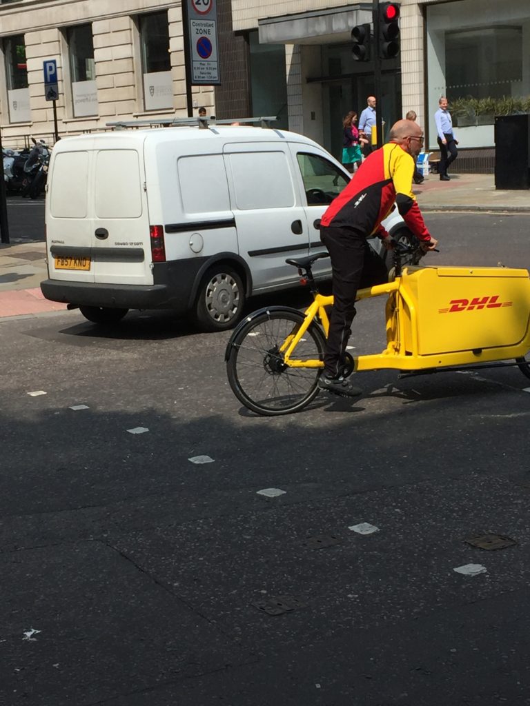 Forgot about the T-shirt for a moment: DHL guy and White Van Man contest a T-junction